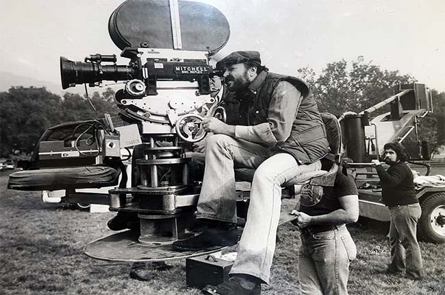 photo of Patrick Walsh shooting with a film camera